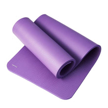 Purple yoga mat with rolled layers, textured non-slip surface