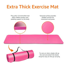 Extra thick exercise yoga mat in bright pink with textured surface and carrying strap