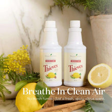 Two Young Living Thieves household cleaner bottles with lemon and floral decor