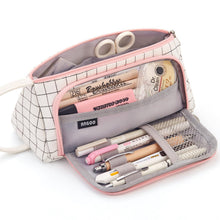 Canvas pencil storage bag with scissors compartments, grid exterior, pink zipper trim, side handle