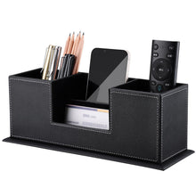 Black PU leather desk organizer with four sections holding pens, phone, remote, and cards