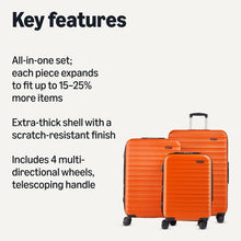 Orange hardside spinner suitcase set view with telescoping handle and multi-directional wheels