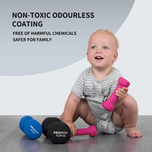 Pink neoprene dumbbell held by a smiling toddler with round textured ends.