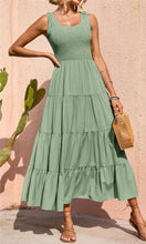 Sage green sleeveless smocked bodice tiered midi dress with relaxed A-line skirt
