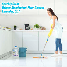 Disinfectant floor cleaner bottle with blue cap near mopping supplies