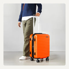 Maleta rígida con ruedas Amazon Basics, 55 cm (21 pulgadas), ABS, color naranja