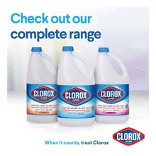 Set of three liquid bleach jugs with blue caps and floral-scent labels