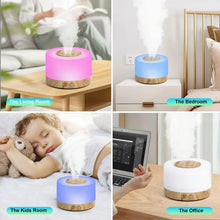 Cool mist aroma diffuser with pink LED light, white housing and wood-grain base