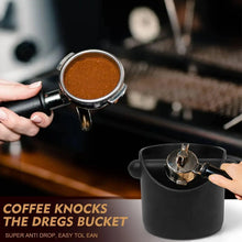 Black coffee grounds bucket with knock bar inserted and side handles