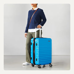 Maleta rígida con ruedas Amazon Basics de 26 pulgadas (68 cm), material: ABS, color azul claro