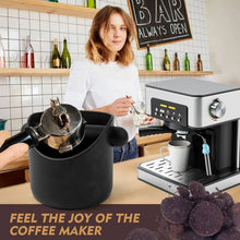 Black coffee grounds bucket with side handles and attached knock bar on countertop