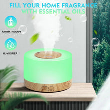 Green LED aroma diffuser releasing cool mist, with wood-grain base