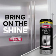 Weiman stainless steel cleaning wipes canister near stainless refrigerator doors