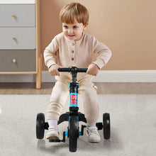 Child riding a blue kids balance bike tricycle with black seat and three wheels