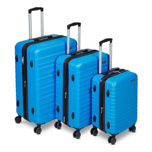 Three blue hardside spinner suitcases with black handles and telescoping upright grips
