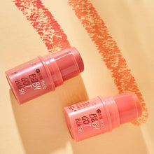 Two Essence Baby got Blush balm containers with pink swatches on skin