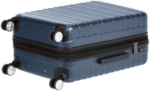 Navy polycarbonate spinner luggage with TSA lock panel and textured ridges