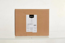 Cardboard shipping box with front shipping label and reinforced corners