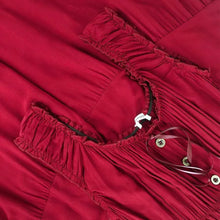 Red sleeveless tiered dress bodice with ruched neckline and button placket