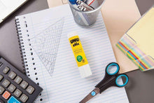 UHU stic glue stick with yellow label on a white stick