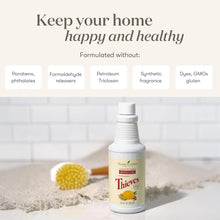 Young Living Thieves cleaner bottle with scrubbing brush and cleaning foam