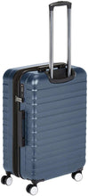 Navy polycarbonate spinner luggage with retractable trolley handle and side latch