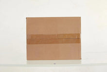 Brown shipping box with sealed top and printed label