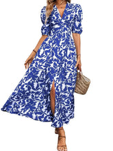 Blue and white floral print maxi dress with V-neck, puff sleeves, and side slit