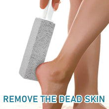Pumice cleaning stone on white handle held in hand