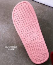 Pink textured rubber outsole for shower slippers, embossed grip pattern