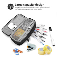 Black pencil case with two front mesh pockets holding pens, notes, and small supplies