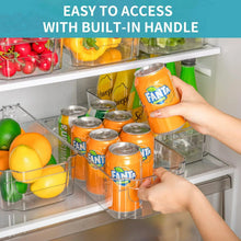 Clear storage bin with built-in handle, holding canned drinks