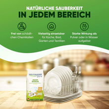 HEITMANN pure soda pouch next to stacked dishware and a drying rack