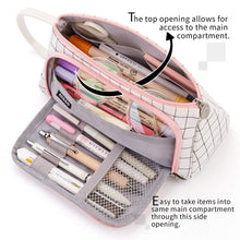Canvas pencil storage bag with wide top opening, grid exterior, pink trim, internal compartments