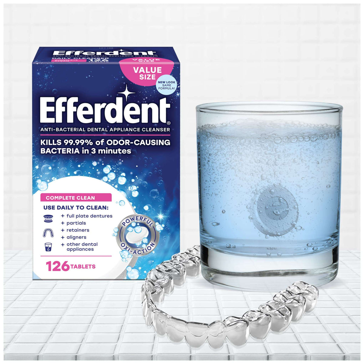Efferdent retainer cleaning tablets box with fizzing glass solution and clear dental retainer for daily cleaning