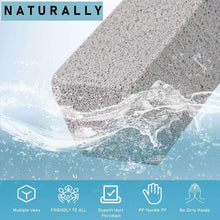 Pumice cleaning stone on white handle over water