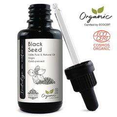 Black glass bottle and dropper of organic black seed oil for hair growth from Aroma Tierra Store