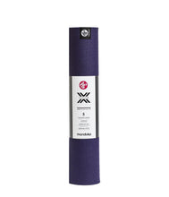 Manduka X yoga mat roll, purple textured surface with end branding