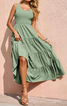 Sage green sleeveless smocked tank dress with tiered ruffle skirt and asymmetrical drape