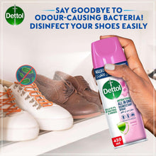 Hand holding Dettol disinfectant spray bottle, lavender scent, 450 ml