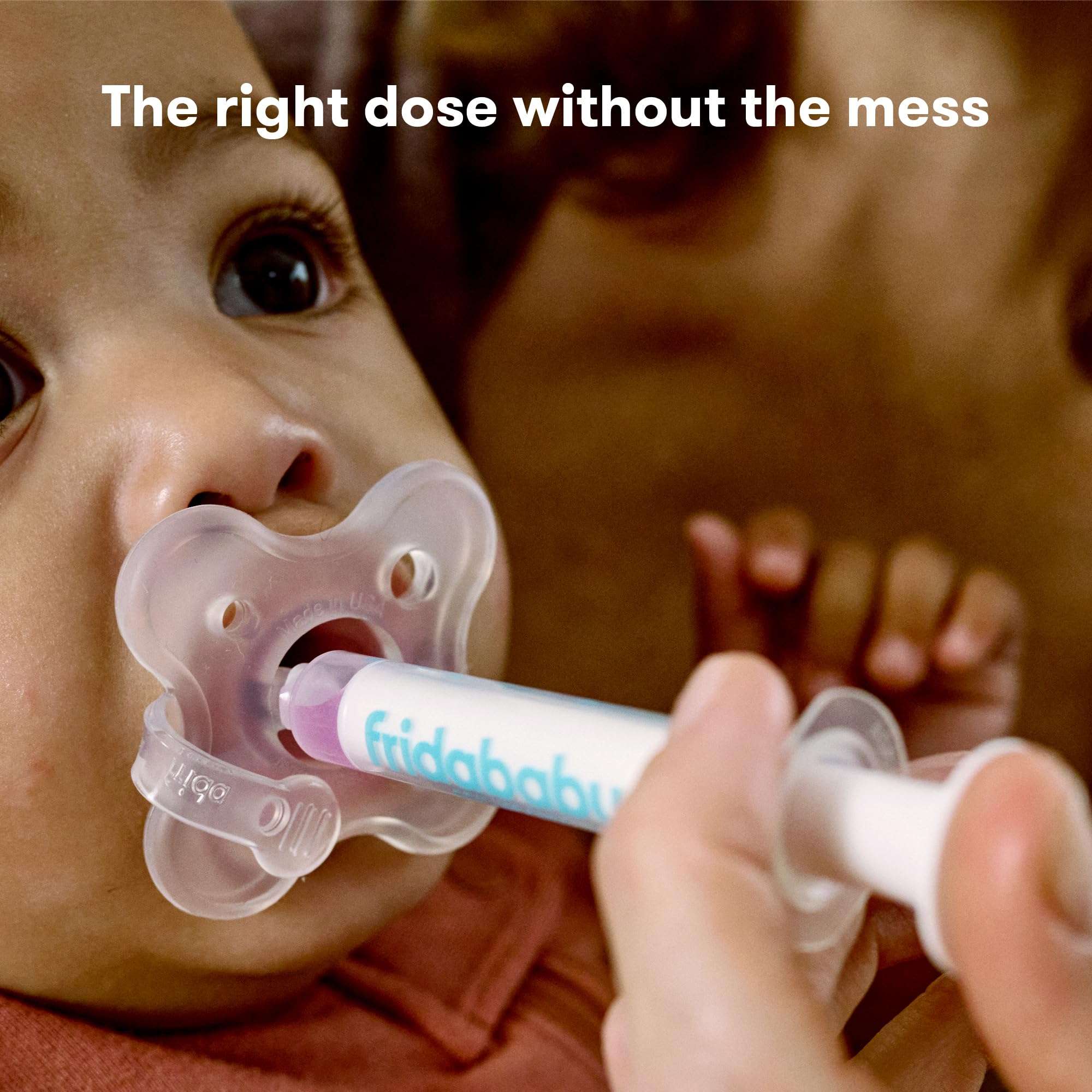 Frida Baby MediFrida Accu-Dose Pacifier used to deliver medicine to baby hygienically and accurately