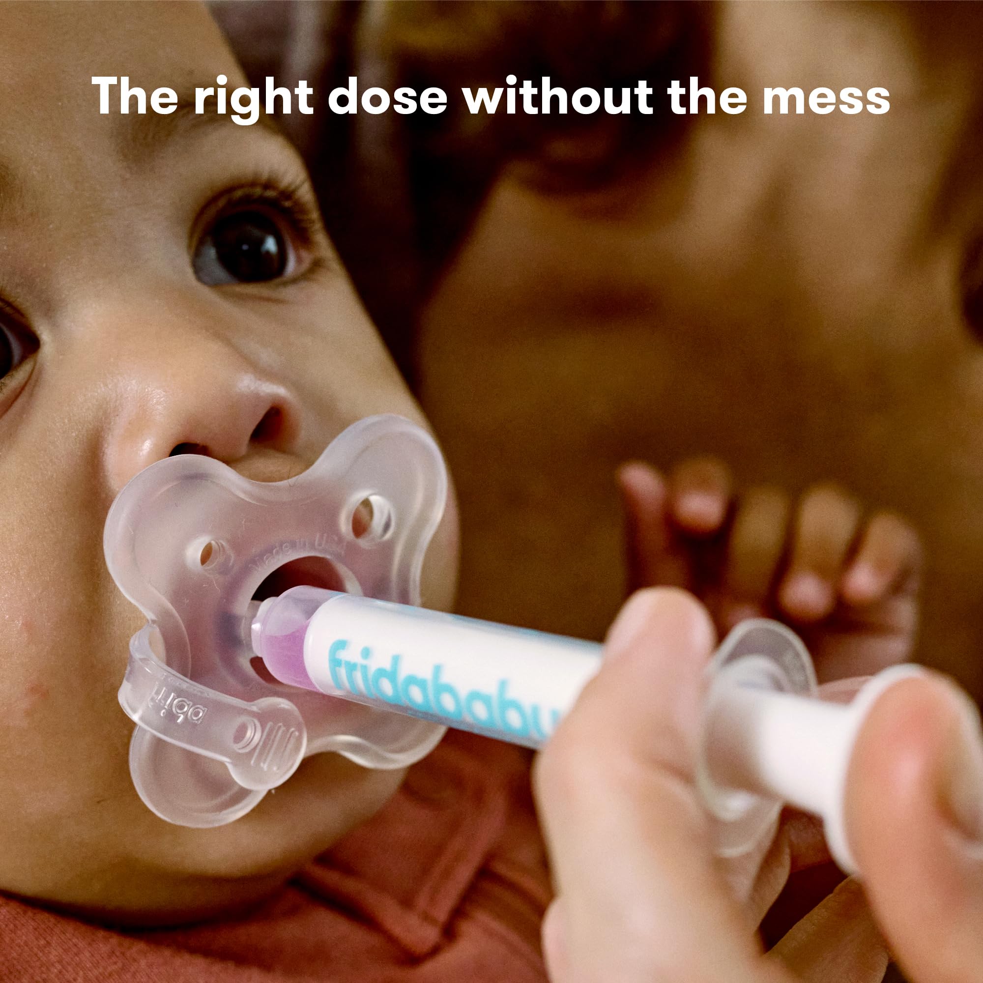 Frida Baby MediFrida Accu-Dose Pacifier used to deliver medicine to baby hygienically and accurately