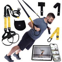 Suspension training straps with yellow anchors, black handles, and shoulder harness set