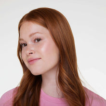Woman with soft pink blush makeup and natural glossy lips