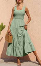 Sage green tiered smocked tank dress with sleeveless bodice and flowing midi skirt