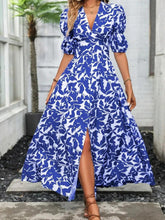 Blue and white floral print maxi dress with V-neck and flowing skirt with side slit