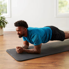 Dark gray yoga mat with ribbed texture, laid flat on the floor