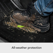 Black rubber floor mat with deep grooves and raised tread texture