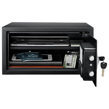 Black steel security safe with side-opening door showing interior storage