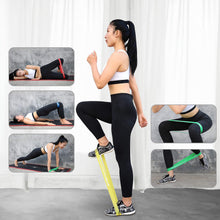 Resistance loop bands used around ankles and thighs with black leggings; yellow and green